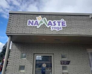 Namaste Yoga vinyl sign on wall made by SignScapes in Michigan